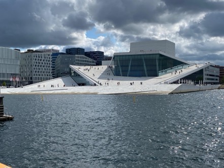 partly cloudy skies over the opera house in Oslo, Norway