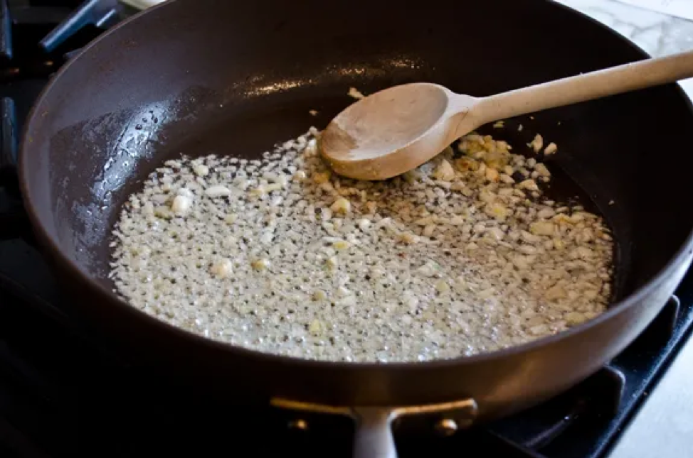 garlic frying in a pan